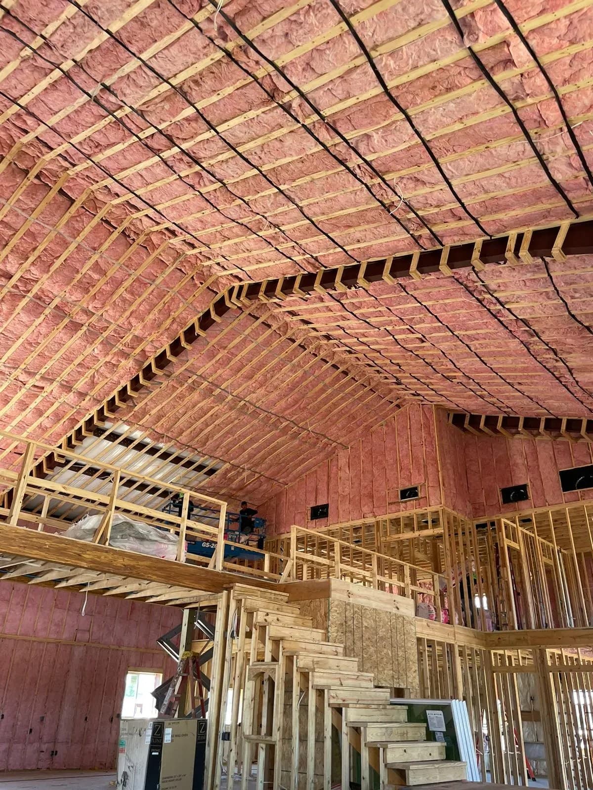 Old attic insulation being professionally removed with specialized equipment