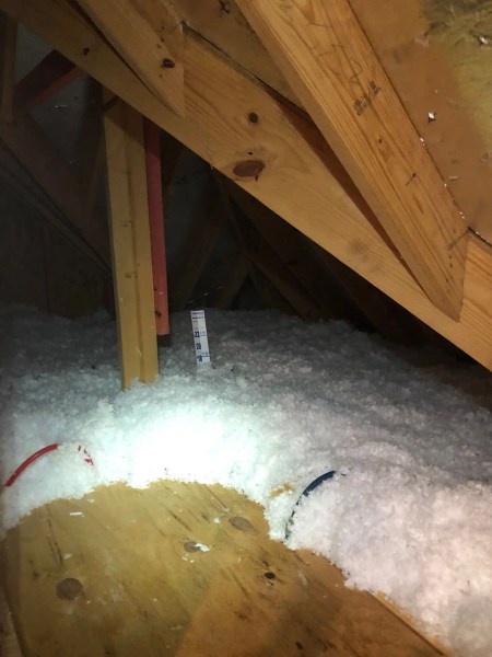 showing the depth of attic insulation